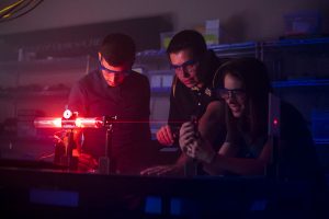 Students look at laser beam