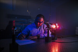 Student looks at laser