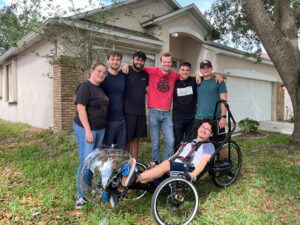 Student team poses with recumbent bicycle