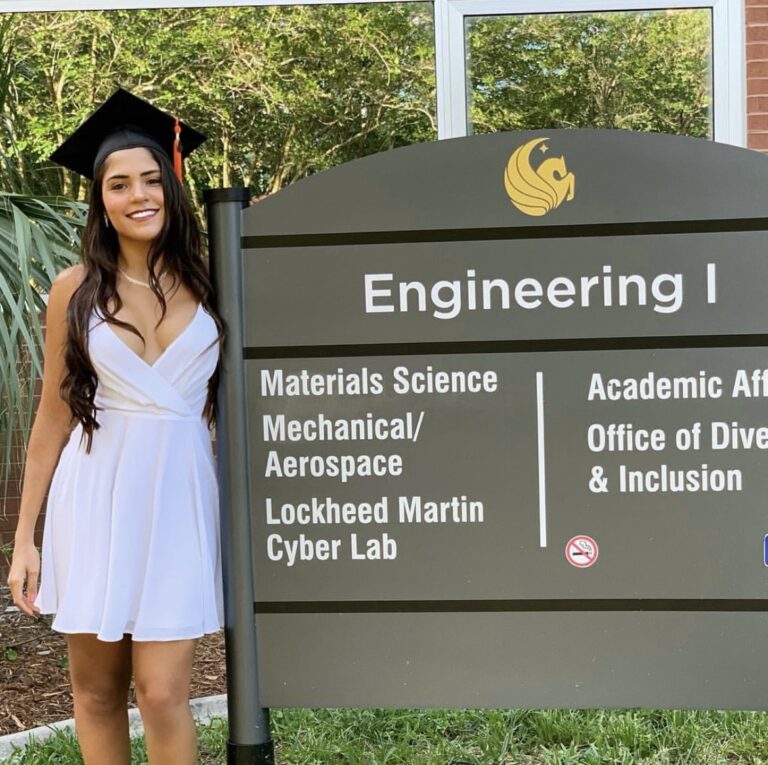 Eduarda Ferreira in front of MAE sign