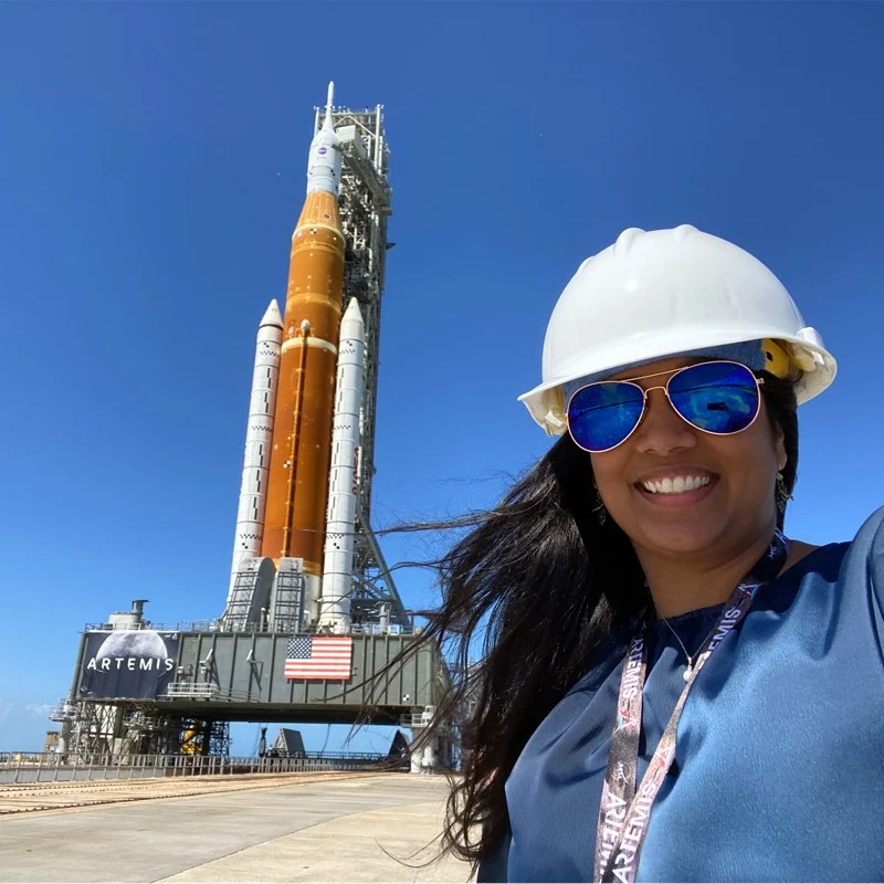 Laura Polish in front of rocket