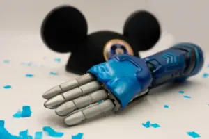 Bionic hand next to Disney ears hat